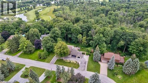 Aerial perspective showcasing two residential properties with expansive green spaces - 355 Edgehill Drive, Kitchener, ON 