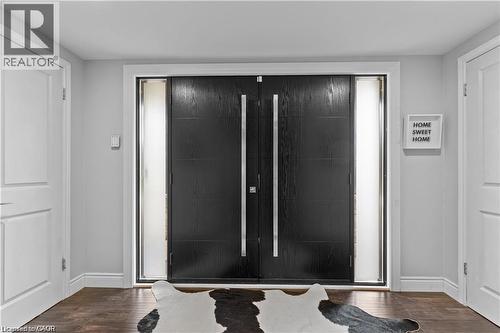 Double entry doors in a rich dark finish, featuring full-length vertical hardware - 355 Edgehill Drive, Kitchener, ON 