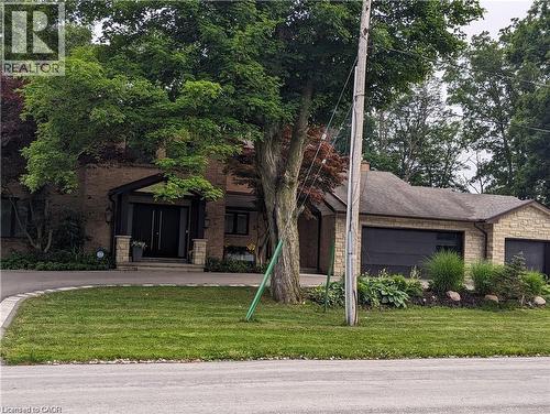 Brick exterior with prominent dual black entry doors beneath a covered portico - 355 Edgehill Drive, Kitchener, ON 
