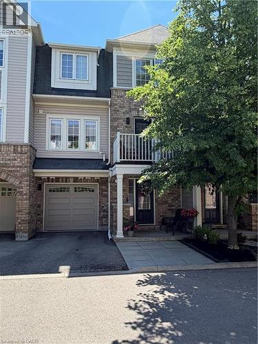Multi-level townhouse with brick and siding facade - 7 Sirente Drive Unit# 11, Hamilton, ON - Outdoor With Facade