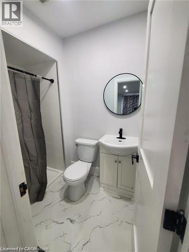 Bathroom featuring white walls and a white-and-gray patterned floor - 94 Brook Street, Simcoe, ON - Indoor Photo Showing Bathroom