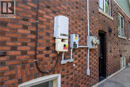 Red brick exterior with varied brickwork patterns - 22 Connaught Avenue S, Hamilton, ON 