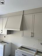 Tasteful trim work and matching range hood - 