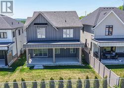 Partially fenced and hedged backyard - 