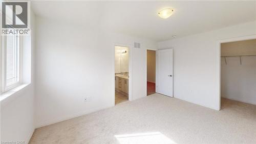 Neutral-toned carpeting paired with white walls - 200 Cittadella Boulevard, Hamilton, ON 