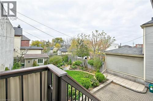 Expansive rear yard featuring a manicured lawn, established landscaping, and a paver patio - 1476 Barton Street E Unit# 2, Hamilton, ON 