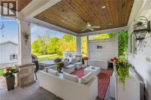 Covered patio featuring a wood-finish plank ceiling, recessed lighting, and a ceiling fan - 6195 Milburough Line, Burlington, ON - Outdoor With Deck Patio Veranda With Exterior
