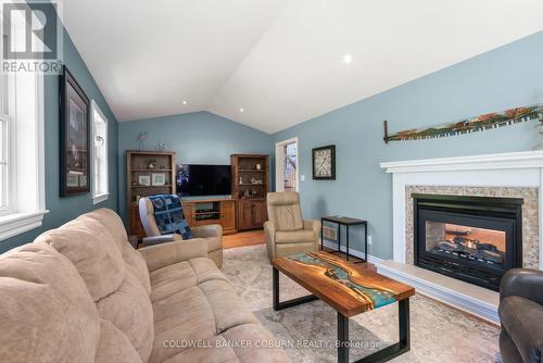 Living room with 2 way fireplace - 397 Burchill Road, Montague, ON 