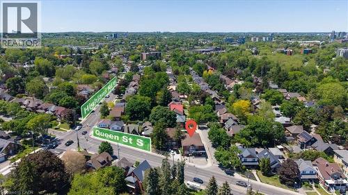 Aerial perspective showcasing a residential neighborhood with mature trees and varied architectural styles - 744 Queen Street S, Kitchener, ON 