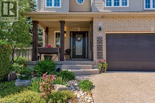 Brick and siding exterior featuring a covered porch with dark wood-finish columns - 61 Ditner Avenue, Baden, ON - Outdoor