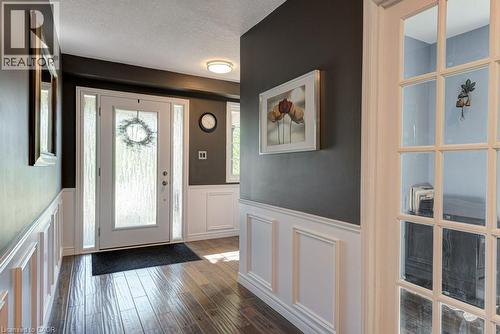 Entry way featuring a decorative front door with textured glass and sidelights - 61 Ditner Avenue, Baden, ON - Indoor Photo Showing Other Room