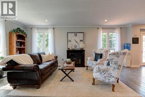 Living area featuring wood-finish flooring, light-toned walls, and recessed lighting - 61 Ditner Avenue, Baden, ON - Indoor Photo Showing Living Room