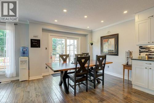 Dining area featuring wood-finish flooring, recessed lighting, and a sliding glass door to the exterior - 61 Ditner Avenue, Baden, ON - Indoor Photo Showing Dining Room