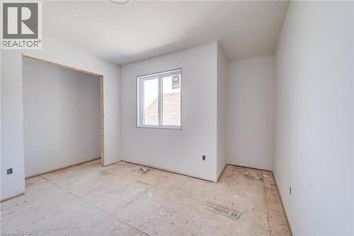 Unfinished room featuring white painted walls, a single-pane window, and exposed subflooring - 114 Bedell Drive, Mapleton, ON - Indoor Photo Showing Other Room