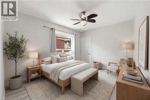 virtually staged primary bedroom - 97 Tragina Avenue S, Hamilton, ON 