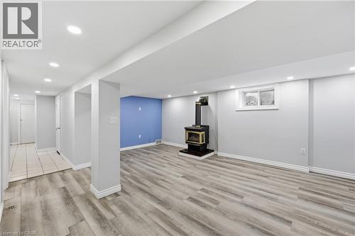 Spacious room featuring wood-finish flooring - 97 Tragina Avenue S, Hamilton, ON 
