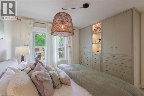 Built-in cabinetry with integrated lighting and varied storage configurations - 41 Park Row N, Hamilton, ON 