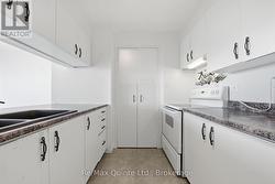 Kitchen also features a large pantry for storage. - 