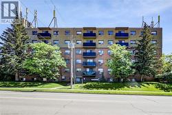 Multi-story building featuring brick and stucco siding - 