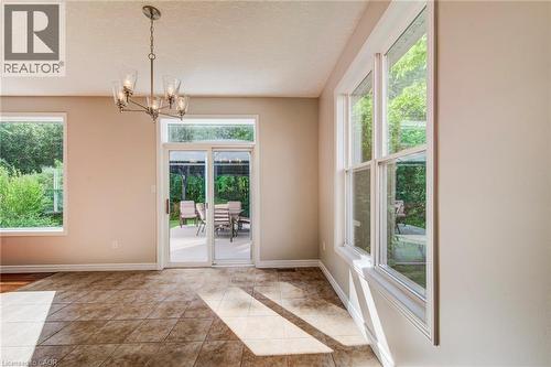 Plenty of windows, walk-out to deck. - 712 Brookmill Place, Waterloo, ON 
