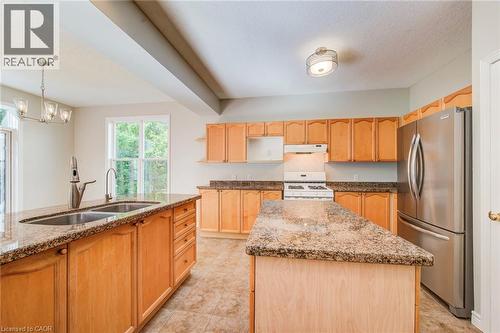 Kitchen is spacious with efficient layout. - 712 Brookmill Place, Waterloo, ON 
