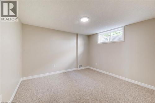 One of two bedrooms in lowest level. - 712 Brookmill Place, Waterloo, ON 