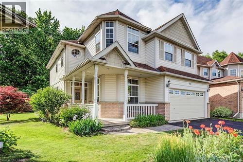 Welcoming, covered entry. - 712 Brookmill Place, Waterloo, ON 