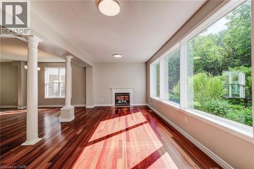Living room with 3 huge picture windows. - 712 Brookmill Place, Waterloo, ON 