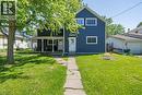 Two-story residential structure featuring blue siding and white trim - 54 E Chestnut Street E, St. Catharines, ON 