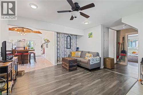 Spacious living area featuring wood-finish flooring, recessed lighting, and a ceiling fan - 54 E Chestnut Street E, St. Catharines, ON - Indoor