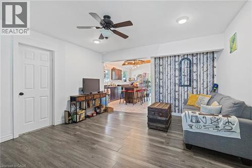 Open-concept living space featuring wood-finish flooring and a ceiling fan - 54 E Chestnut Street E, St. Catharines, ON - Indoor