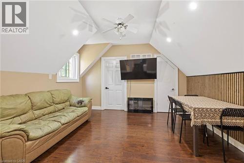 Spacious room with wood-finish flooring, an angled ceiling, a ceiling fan, and recessed lighting - 54 E Chestnut Street E, St. Catharines, ON - Indoor Photo Showing Living Room