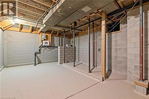 Unfinished basement space with concrete block walls and floor - 54 E Chestnut Street E, St. Catharines, ON - Indoor