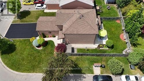 AI Enhanced -Driveway was resealed - 19 Newgreen Crescent, Brampton, ON 