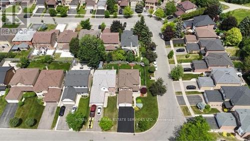 AI Enhanced -Driveway was resealed - 19 Newgreen Crescent, Brampton, ON 