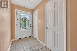 Front Foyer with coat closet & 2 piece Bath - 