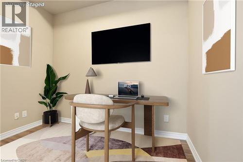 Neutral wall paint, white baseboards, and wood-finish flooring define this space - 40 Esplanade Lane Unit# 614, Grimsby, ON 