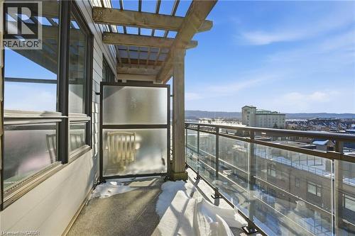 Balcony featuring glass panel railings, a wooden pergola, and a concrete floor - 40 Esplanade Lane Unit# 614, Grimsby, ON 