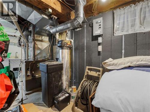 Utility area featuring exposed wood ceiling joists and concrete flooring - 420 Waverly Street, Hamilton, ON 