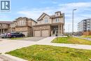Two-story residence featuring a brick and siding exterior, a covered front porch, and a double-car garage - 417 Rivertrail Avenue, Kitchener, ON 