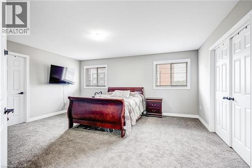 Spacious room with light gray walls and gray carpet flooring - 417 Rivertrail Avenue, Kitchener, ON 
