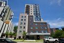 Modern multi-story building featuring a brick and stone facade - 246 Lester Street Unit# 306, Waterloo, ON 