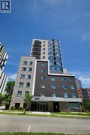 Modern high-rise building with a multi-textured facade - 