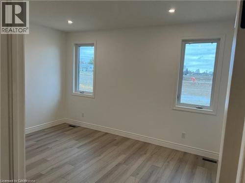 Unfurnished room with light wood-style flooring, baseboards, and recessed lighting - 207 Arden Crescent Unit# Upper Level, Mitchell, ON 