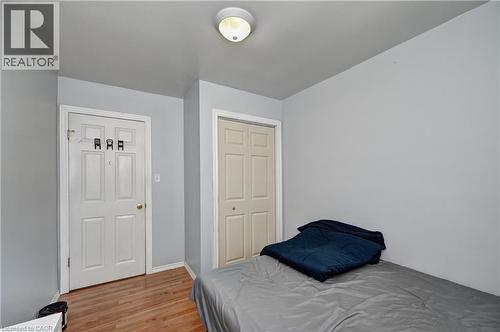 Light gray wall tones with wood-finish flooring - 525 Fallingbrook Drive, Waterloo, ON 