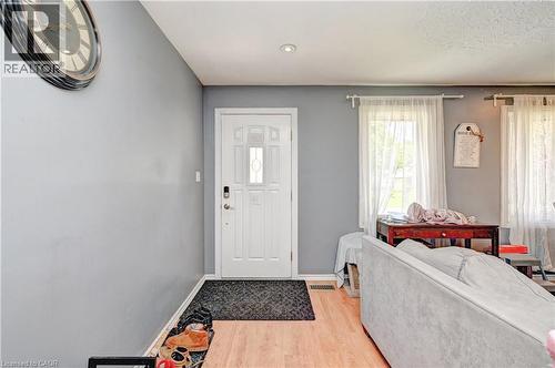 White paneled entry door with decorative glass inserts - 525 Fallingbrook Drive, Waterloo, ON 