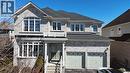 View of front of property featuring driveway, an attached garage, roof with shingles, and brick siding - 512 Terrington Crescent, Kitchener, ON 