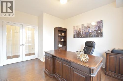 Home office featuring french doors and dark wood-type flooring - 512 Terrington Crescent, Kitchener, ON 