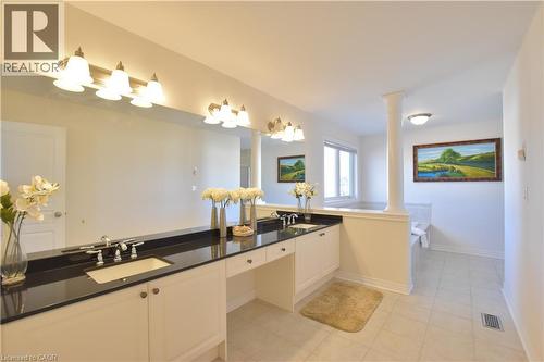 Full bathroom with double vanity, a bath, and light tile patterned floors - 512 Terrington Crescent, Kitchener, ON 