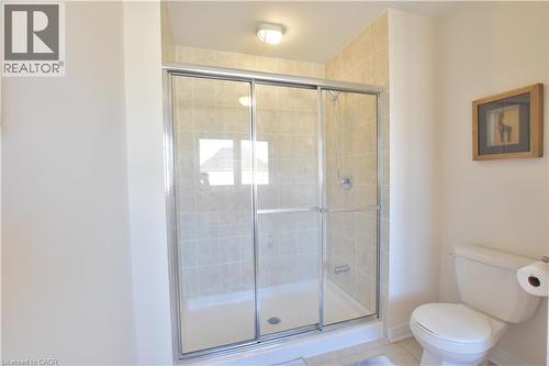 Bathroom featuring a shower stall and light tile patterned flooring - 512 Terrington Crescent, Kitchener, ON 